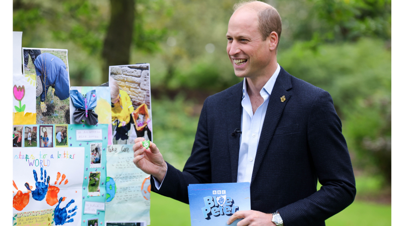 His Royal Highness The Prince of Wales is awarded a green Blue Peter badge